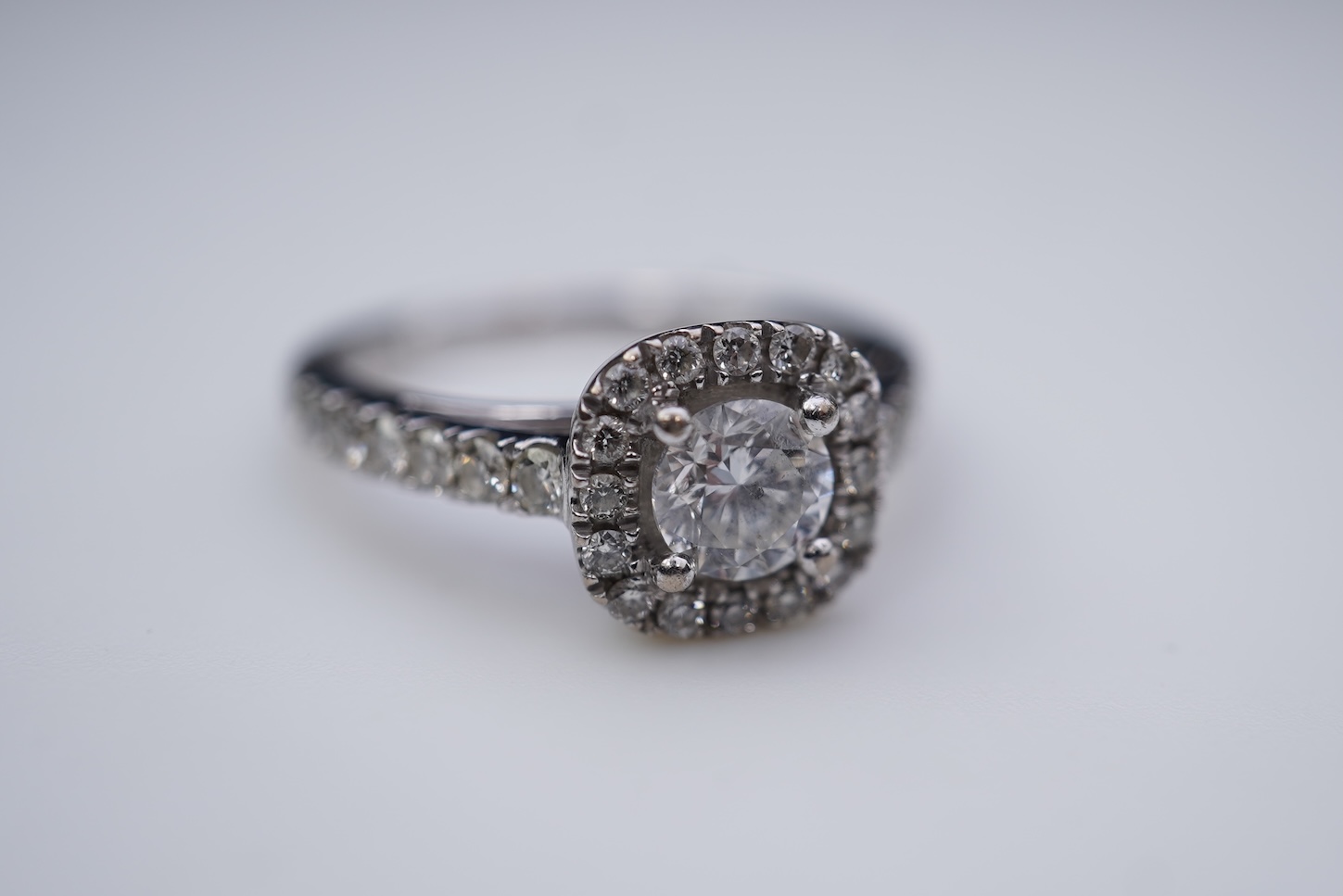 A diamond engagement ring and half eternity ring
